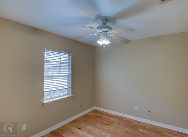 spare room with light hardwood / wood-style floors and ceiling fan