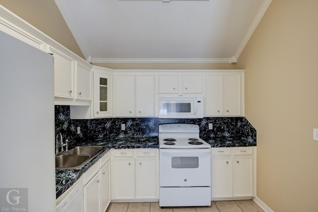 kitchen with sink, white cabinetry, light tile patterned floors, white appliances, and backsplash