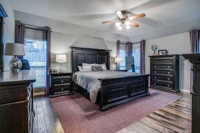 bedroom featuring hardwood / wood-style flooring and ceiling fan