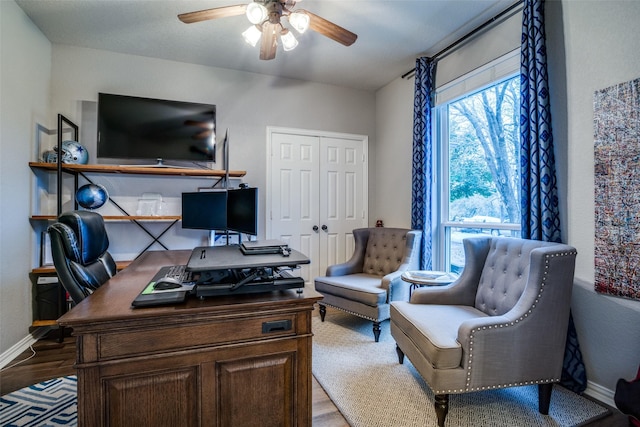 office space featuring ceiling fan and light hardwood / wood-style floors