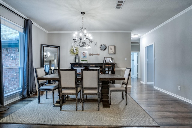 dining space with ornamental molding, a notable chandelier, and dark hardwood / wood-style flooring