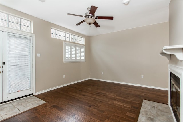 foyer entrance featuring ceiling fan and wood-type flooring