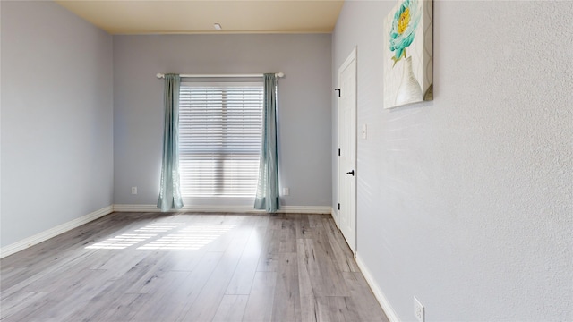 unfurnished room featuring light wood-type flooring