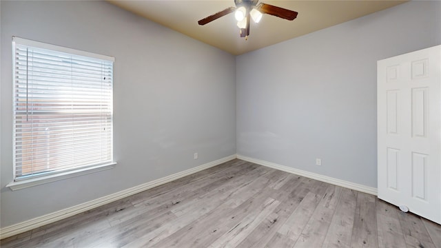 empty room featuring ceiling fan and light hardwood / wood-style flooring