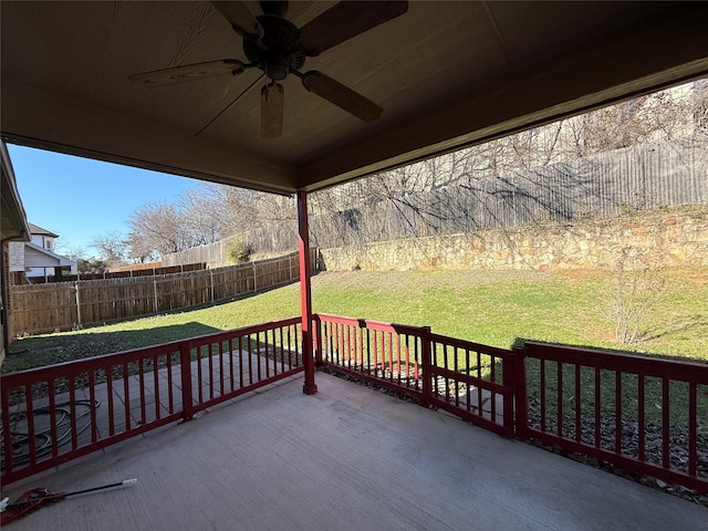 wooden terrace with a patio, a yard, and ceiling fan