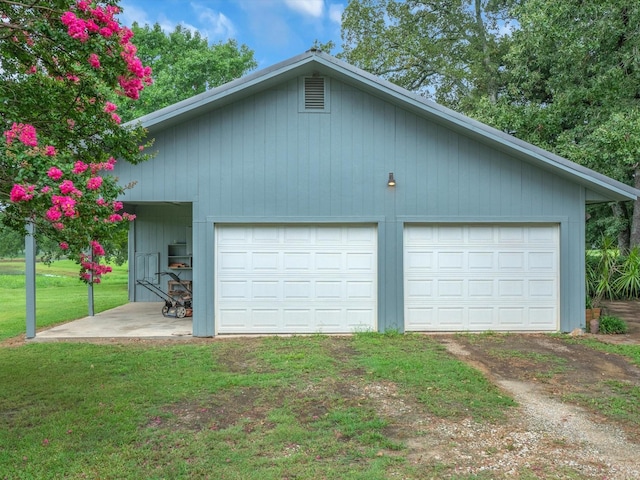 garage with a lawn