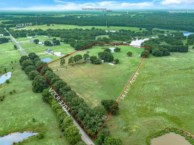 bird's eye view featuring a water view and a rural view