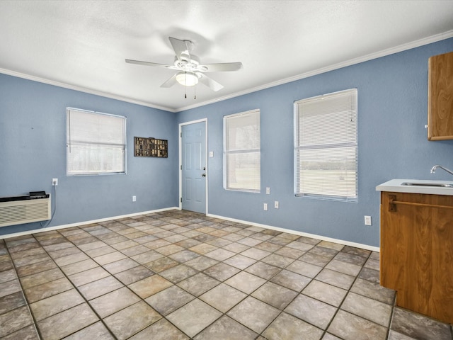 interior space with crown molding, plenty of natural light, and sink