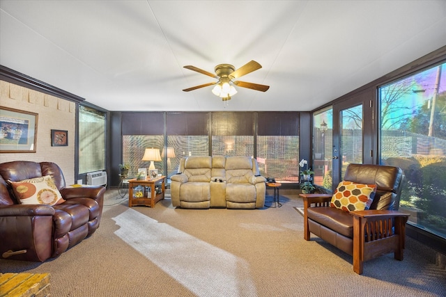 carpeted living room featuring ceiling fan