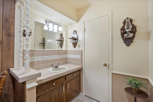 bathroom with vanity and decorative backsplash