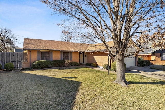 ranch-style house featuring a garage and a front lawn