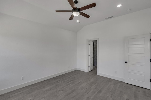 unfurnished room with lofted ceiling, light hardwood / wood-style floors, and ceiling fan