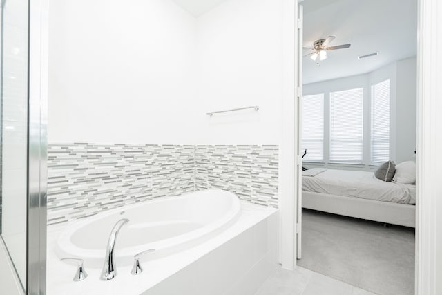 ensuite bathroom with tile patterned floors, visible vents, a garden tub, ensuite bath, and ceiling fan