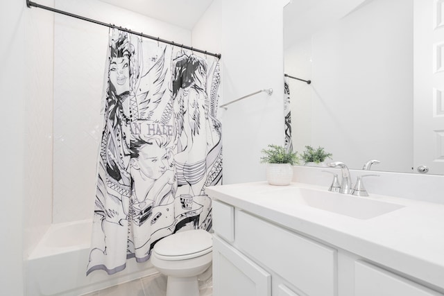 bathroom featuring toilet, shower / bath combo, and vanity