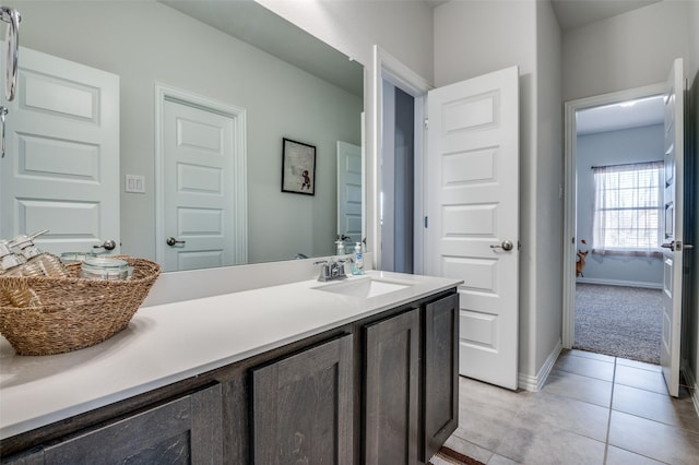 bathroom featuring tile patterned floors and vanity