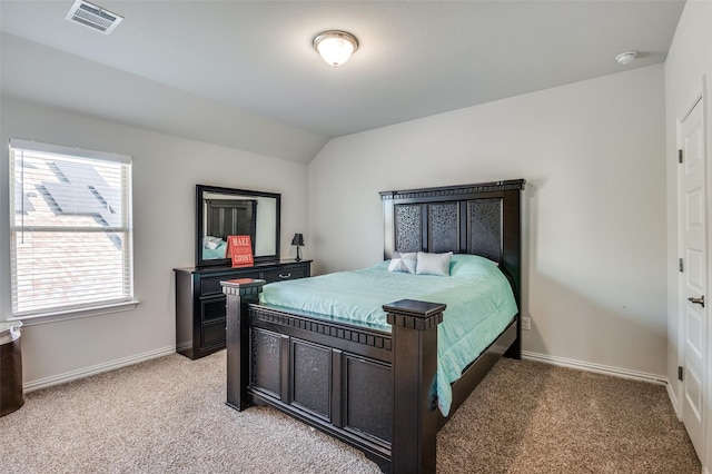 carpeted bedroom featuring lofted ceiling