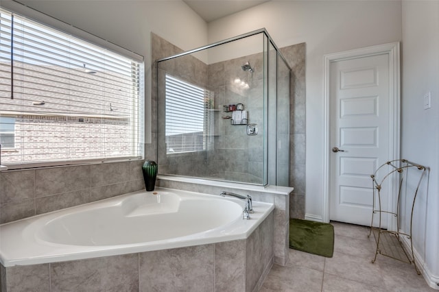 bathroom with tile patterned flooring and plus walk in shower