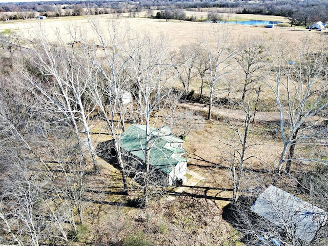 birds eye view of property with a rural view