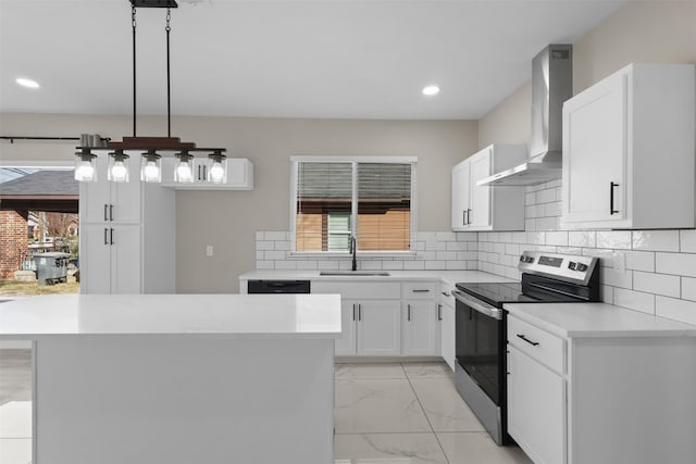 kitchen featuring pendant lighting, sink, white cabinetry, stainless steel range with electric cooktop, and wall chimney exhaust hood