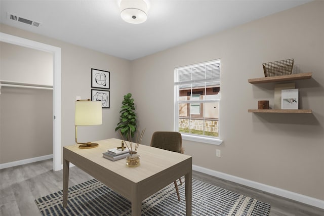 home office featuring hardwood / wood-style floors