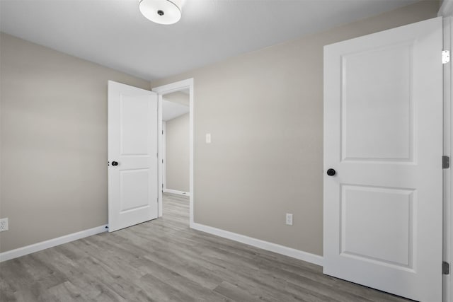 unfurnished bedroom with light hardwood / wood-style floors