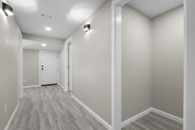 hallway with light wood-type flooring