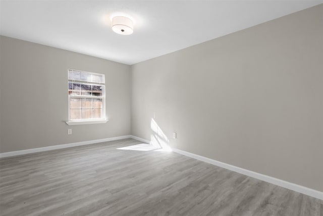 spare room featuring hardwood / wood-style floors