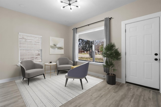 living area with light hardwood / wood-style flooring