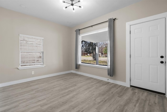 unfurnished room featuring light wood-type flooring