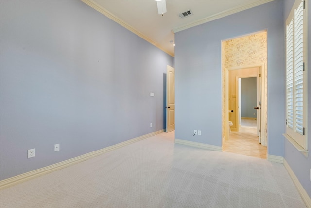 carpeted empty room featuring ornamental molding