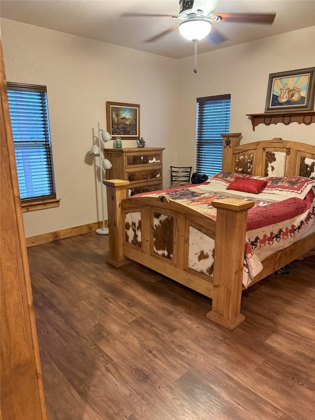 bedroom featuring dark hardwood / wood-style flooring and ceiling fan