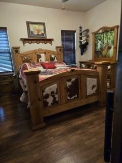 bedroom featuring dark hardwood / wood-style flooring