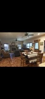 dining area with ceiling fan and wood-type flooring