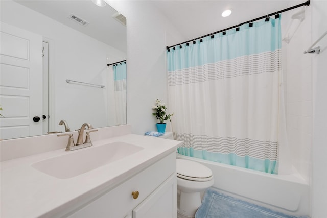 full bath with visible vents, vanity, toilet, tile patterned floors, and shower / tub combo