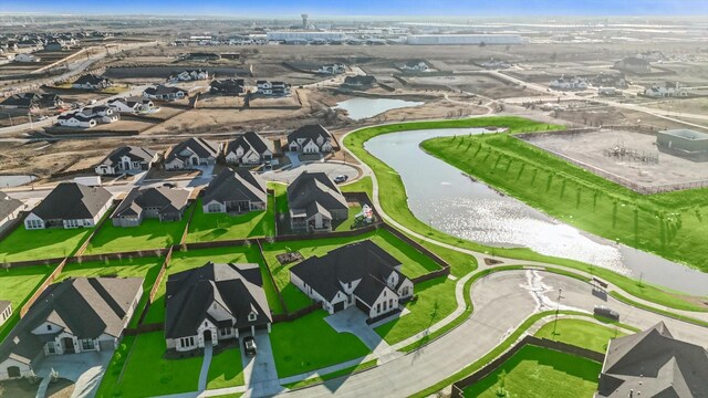 aerial view with a residential view and a water view