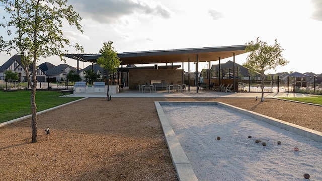view of community featuring fence and a residential view