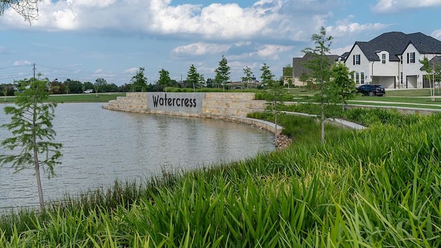 community sign with a water view