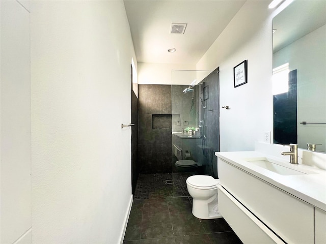 bathroom with visible vents, tile patterned flooring, walk in shower, vanity, and toilet