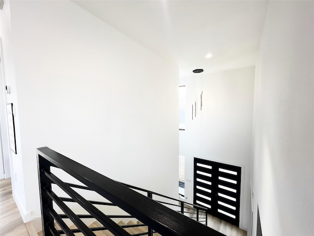 staircase with wood finished floors