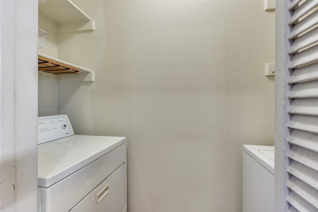 laundry room with washer and clothes dryer