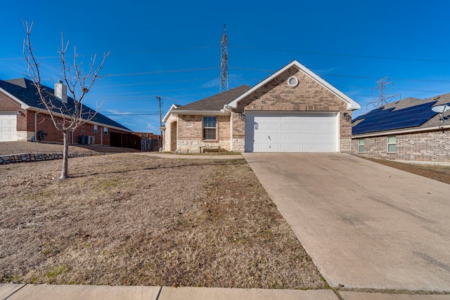 view of front of property featuring cooling unit and a garage