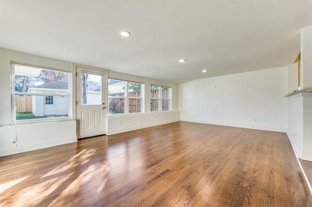 unfurnished living room featuring hardwood / wood-style flooring