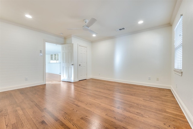 unfurnished room featuring crown molding, ceiling fan, and light hardwood / wood-style flooring