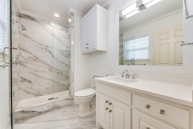 bathroom featuring vanity, crown molding, a shower with shower door, and toilet