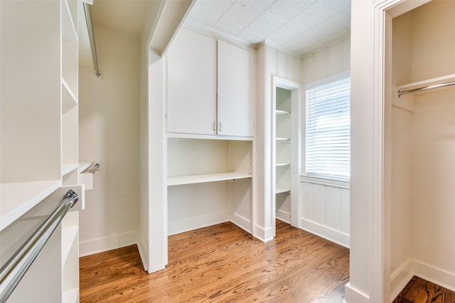 walk in closet featuring light wood-type flooring