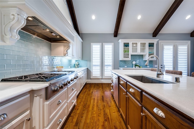 kitchen featuring dark hardwood / wood-style floors, sink, white cabinets, stainless steel appliances, and custom range hood