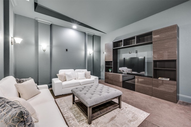 living room featuring decorative columns and carpet