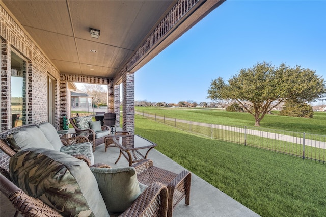 view of patio / terrace featuring an outdoor living space and a rural view