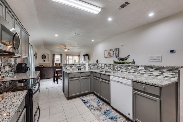 kitchen with black electric range oven, sink, gray cabinetry, and dishwasher