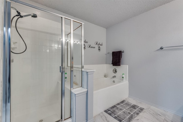 bathroom with independent shower and bath and a textured ceiling